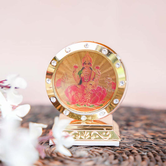 Golden Lakshmi Car Dashboard Stand with Embedded Crystals and Lotus Design.