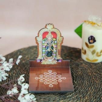 Meenakshi Diya Wall Stand featuring a vibrant depiction of Goddess Meenakshi with a kolam-patterned wooden base for holding oil lamps.