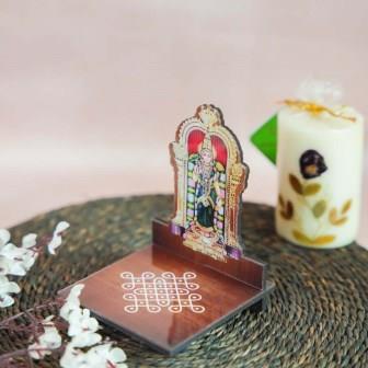 Meenakshi Diya Wall Stand featuring a vibrant depiction of Goddess Meenakshi with a kolam-patterned wooden base for holding oil lamps.