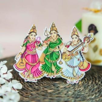 Fridge magnet featuring Goddess Lakshmi, Saraswati, and Durga in vibrant traditional attire, perfect for home decor.