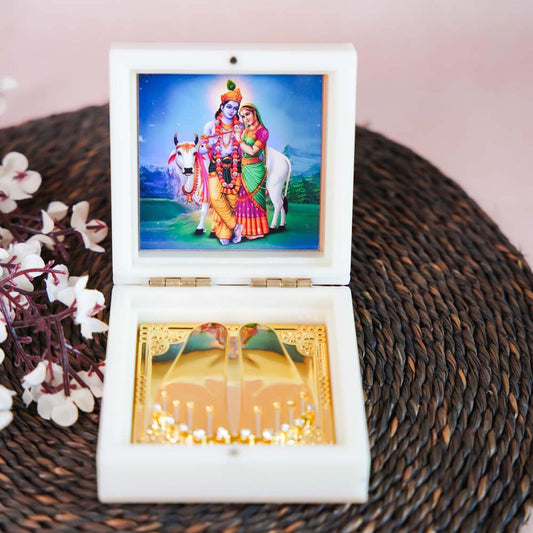 Radha Krishna Paduka in a Decorative Box with Golden Base and a Vibrant Image of Radha and Krishna.