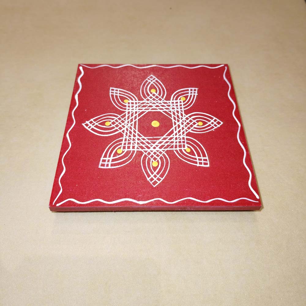 Red Kolam Manai platform with a red kolam design, used for traditional pooja and rituals.