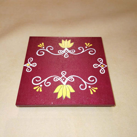 Maroon Kolam Manai platform with a red kolam design, used for traditional pooja and rituals.