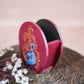 Hand-painted wooden penstand featuring a vibrant blue Annam bird design with intricate gold accents, set against a deep red background.