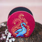 Hand-painted wooden penstand featuring a vibrant blue Annam bird design with intricate gold accents, set against a deep red background.