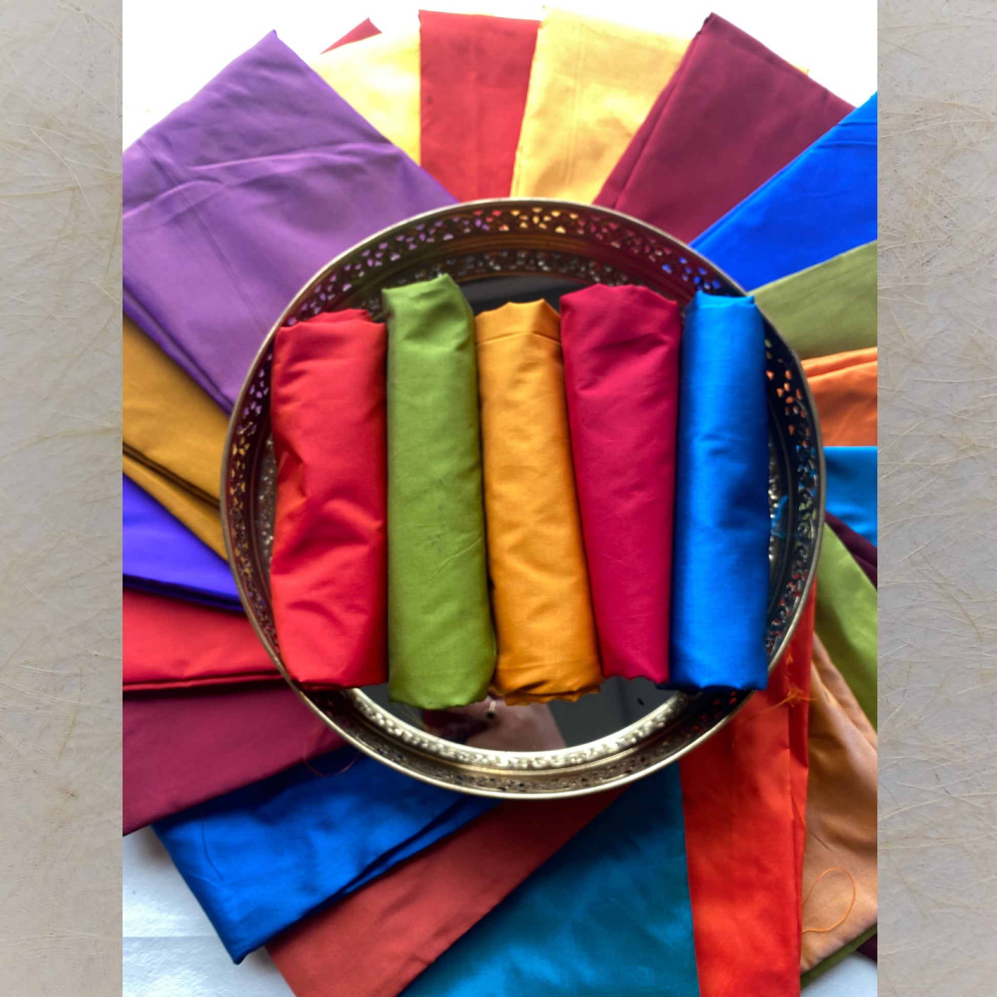 Assorted solid color silk cotton blouse pieces in vibrant shades, ideal for saree pairing and custom tailoring