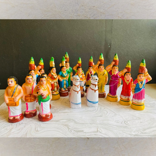 Handcrafted Mulaippari set for Navaratri Golu featuring women with pots, farmers, and bulls in vibrant traditional attire.