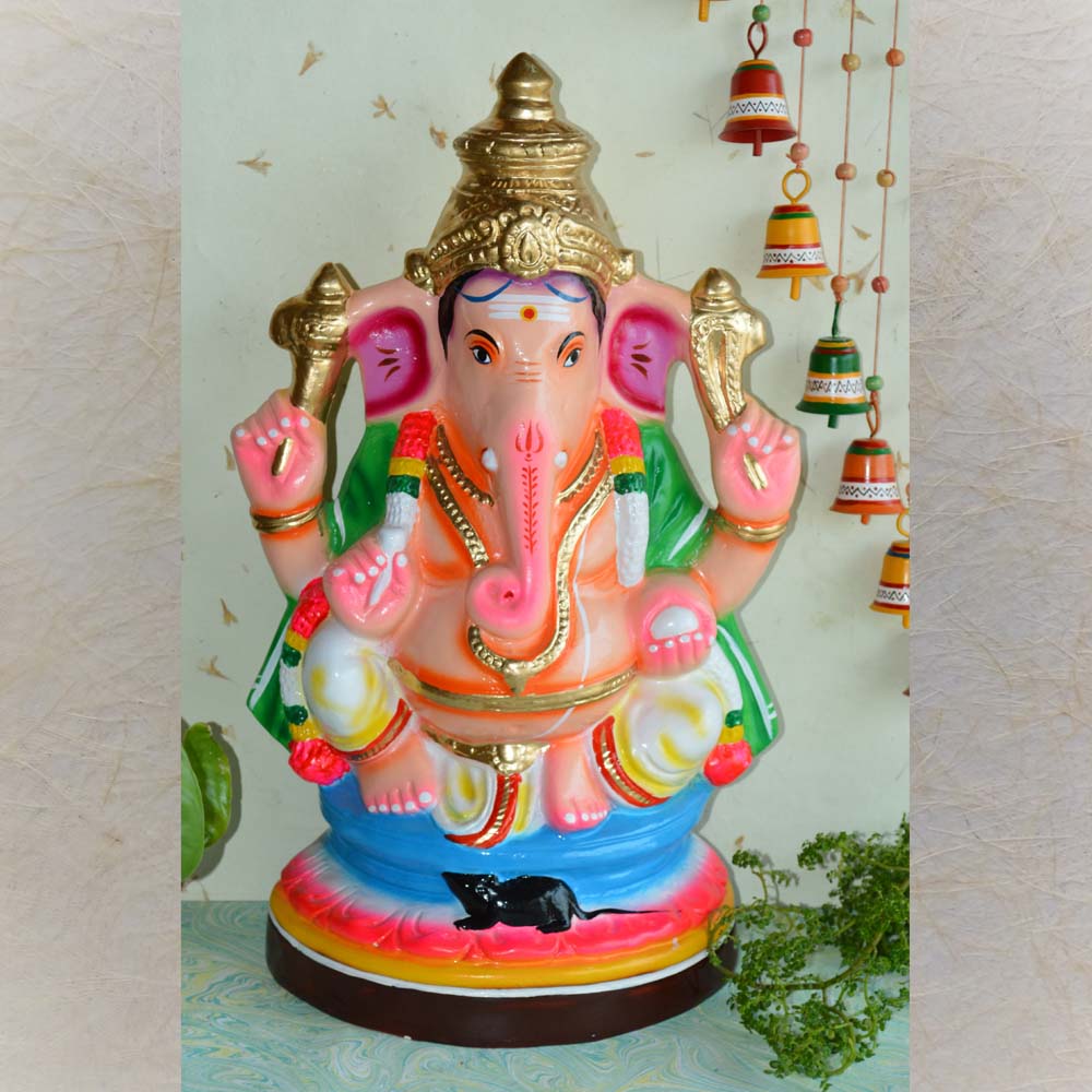 Handcrafted Navarathri Golu doll of Lord Ganesha seated with Mooshika, adorned in vibrant attire.