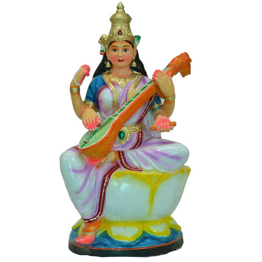 Handcrafted Saraswati idol seated on a lotus, holding a veena, designed for Navarathri Golu displays.