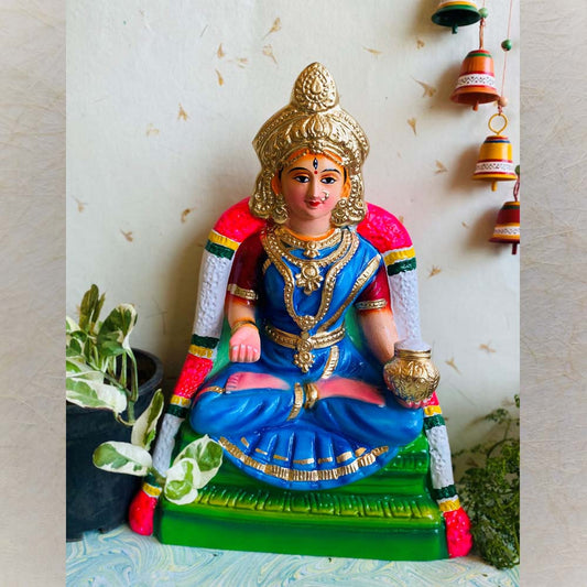 Handcrafted Navarathri Golu doll of Goddess Annapoorani seated, holding a golden pot.