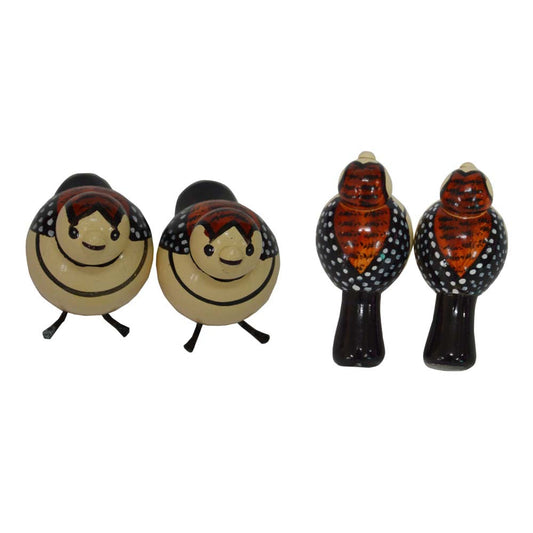 Handcrafted white and black bird figurines for Navaratri Golu, featuring intricate hand-painted designs.