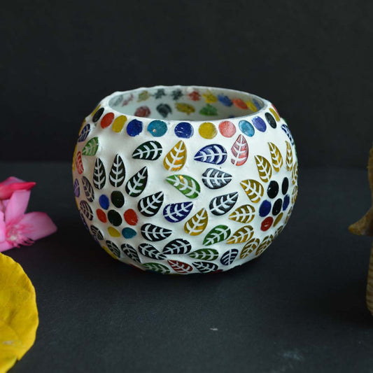 Radiant Mosaic Glass T-Light Holder with colorful hand-painted leaf and dot patterns on a white frosted surface.