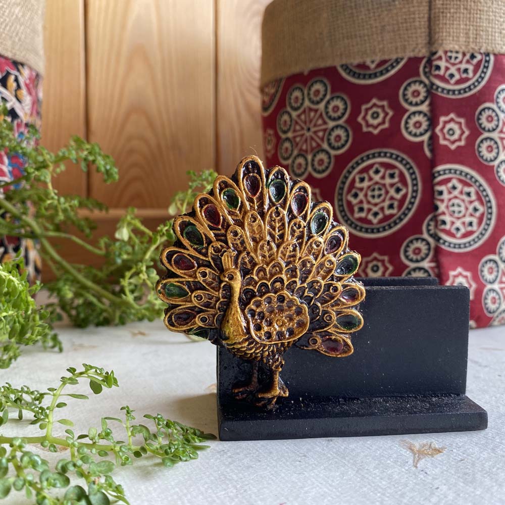 Black visiting card holder with an intricately designed, colorful peacock motif, perfect for office or home desks.
