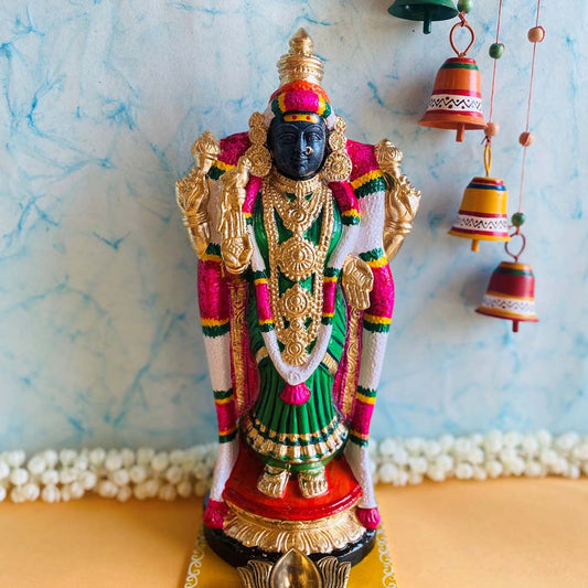 Handcrafted Goddess Akilandeshwari Golu doll adorned in vibrant green and pink attire with intricate gold jewelry and garlands, perfect for Navaratri festival decor.