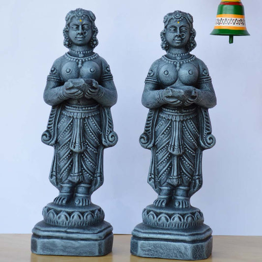 Handcrafted Navaratri Paavai Vilakku Jodi Golu dolls, intricately designed with a stone-like finish, depicting women holding lamps.