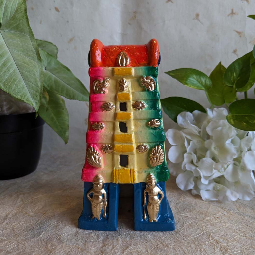 Hand-painted medium-sized Gopuram Golu doll with vibrant multicolored design, featuring intricate temple architecture and golden embellishments, crafted for Navaratri festival decor.