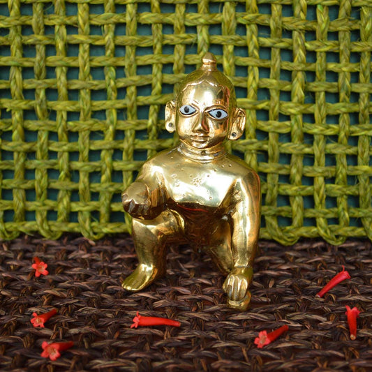 Eternal Baby Krishna Idol, 7-inch handcrafted brass figurine in a crawling pose with intricate detailing.