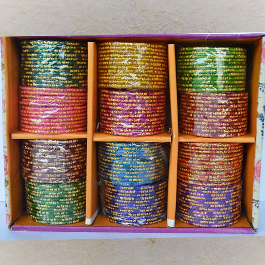 Box of 12 glass bangles in vibrant colors with bold gold dotted lines, perfect for festive occasions, weddings, and traditional wear.