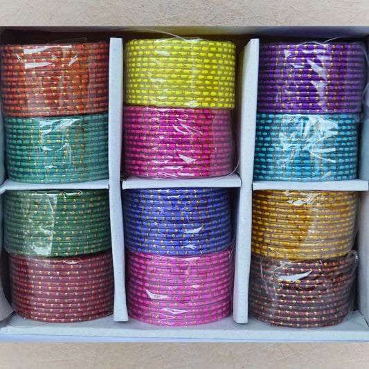Box of 12 colorful glass bangles featuring double-tone dotted patterns, ideal for festive occasions, weddings, and daily wear.