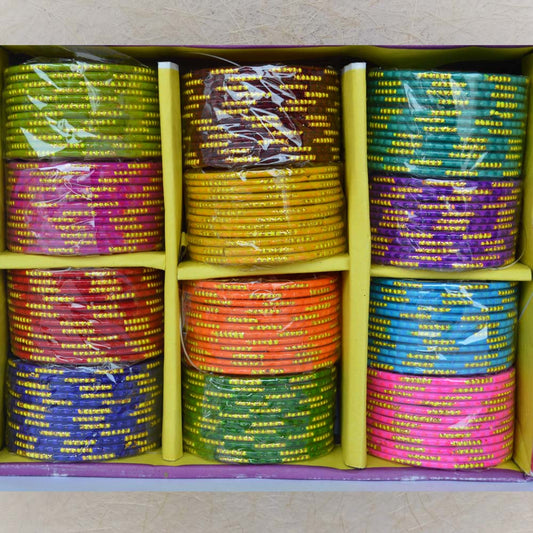 Box of colorful glass bangles with stunning gold cut line detailing, size 2.6, perfect for festive and casual occasions.