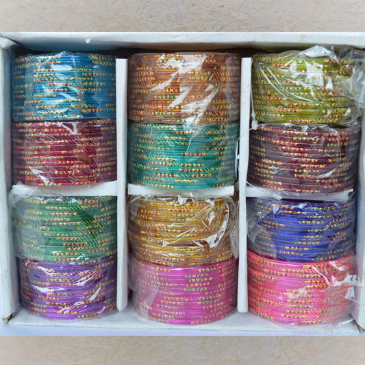 Box of colorful glass bangles featuring self-stripes and golden dot patterns, size 2.8, perfect for festive and casual wear.