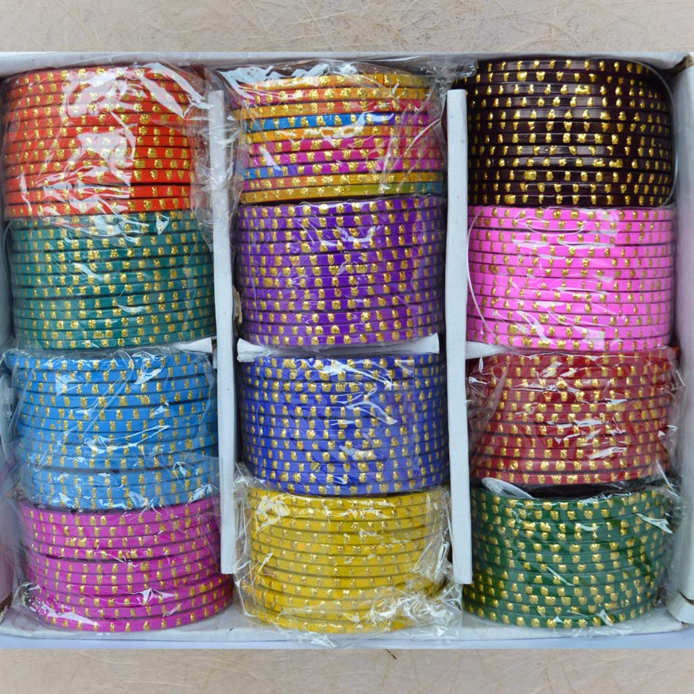 Box of colorful glass bangles with big golden dot patterns, size 2.8, perfect for festive occasions and casual wear.