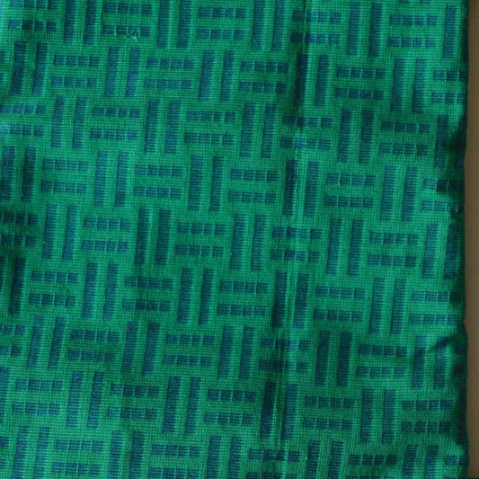 Green blouse fabric with woven geometric design, 80 cm length.