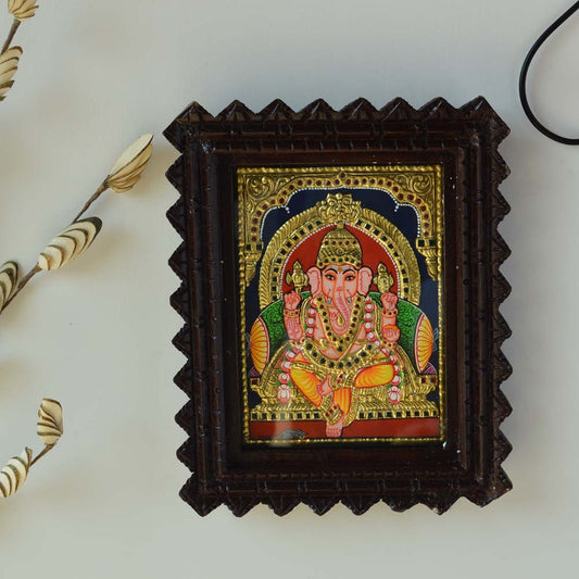 Bejeweled Tanjore Painting of Lord Ganesh in a Carved Wooden Frame with Gold Foil Detailing