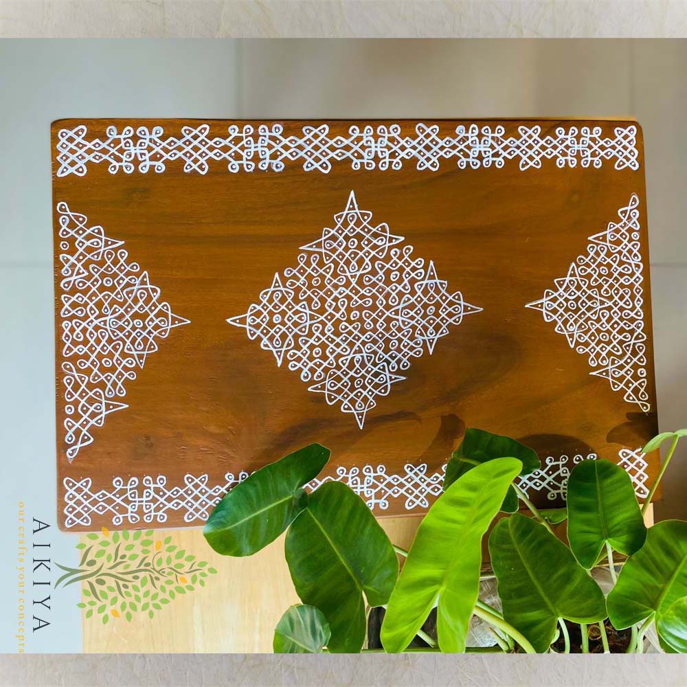 Handcrafted wooden manai with intricate diamond-shaped Kollam patterns in white, polished natural wood finish.