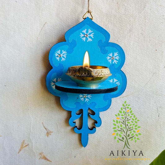 Sky Blue Wooden Wall Bracket with white floral motifs, perfect for holding oil lamps or decorative items.