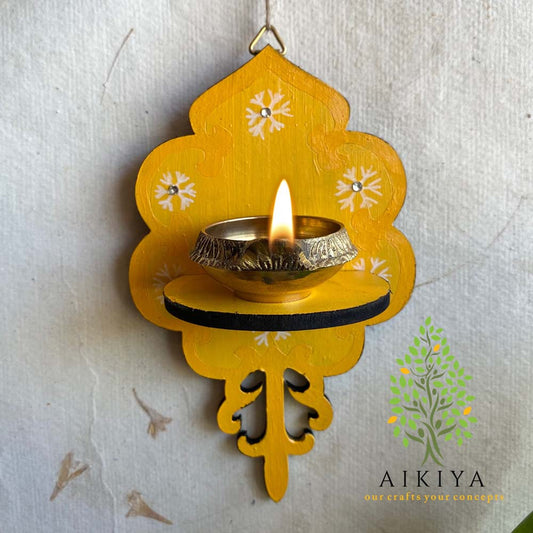 Yellow Wooden Wall Bracket with white floral motifs, perfect for holding oil lamps or decorative accents.