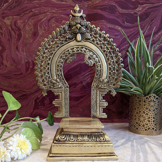 Brass Prabavali with stand featuring intricate handcrafted details, perfect for temples, altars, and traditional decor.