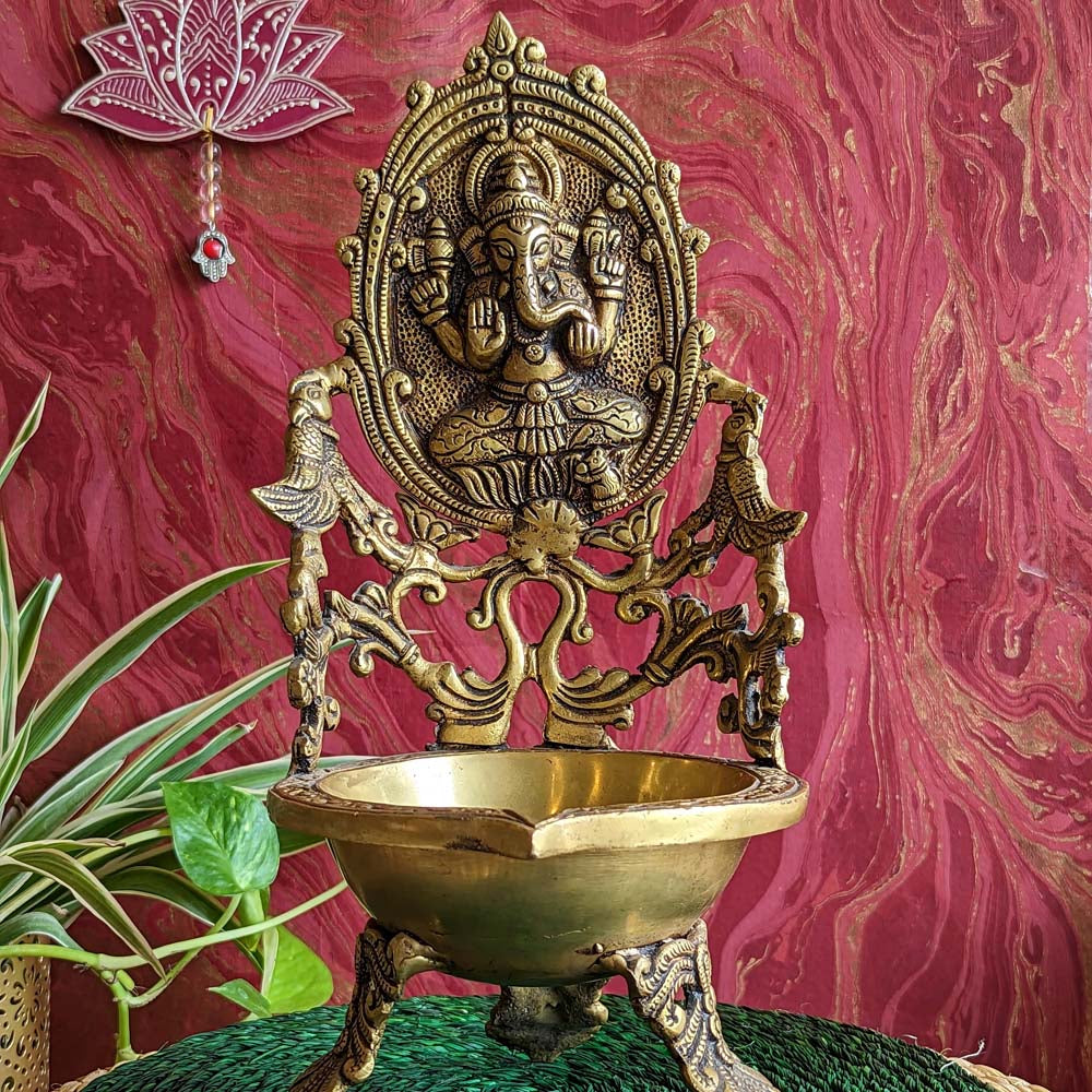 Large brass Ganesh Urli lamp with intricate carvings of Lord Ganesha, designed for pooja and festive decorations.
