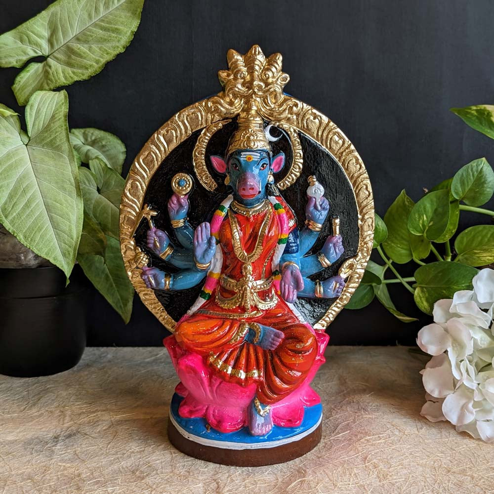 Handcrafted Goddess Varahi Amman Golu doll in red attire with a golden circular arch backdrop, seated on a lotus, ideal for Navaratri festival decor.