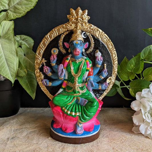Hand-painted Varahi Amman Golu doll in green attire, seated on a lotus pedestal with a golden halo, ideal for Navarathri decoration.