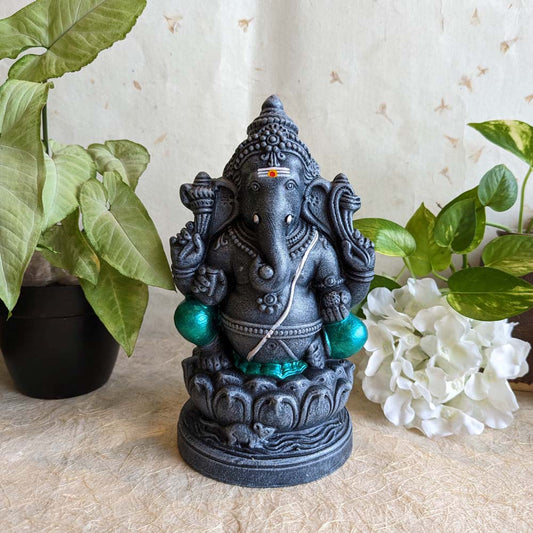 Stone-finish 12-inch Ganesh Golu doll in a seated posture with intricate details and green accents, perfect for Navarathri decoration.