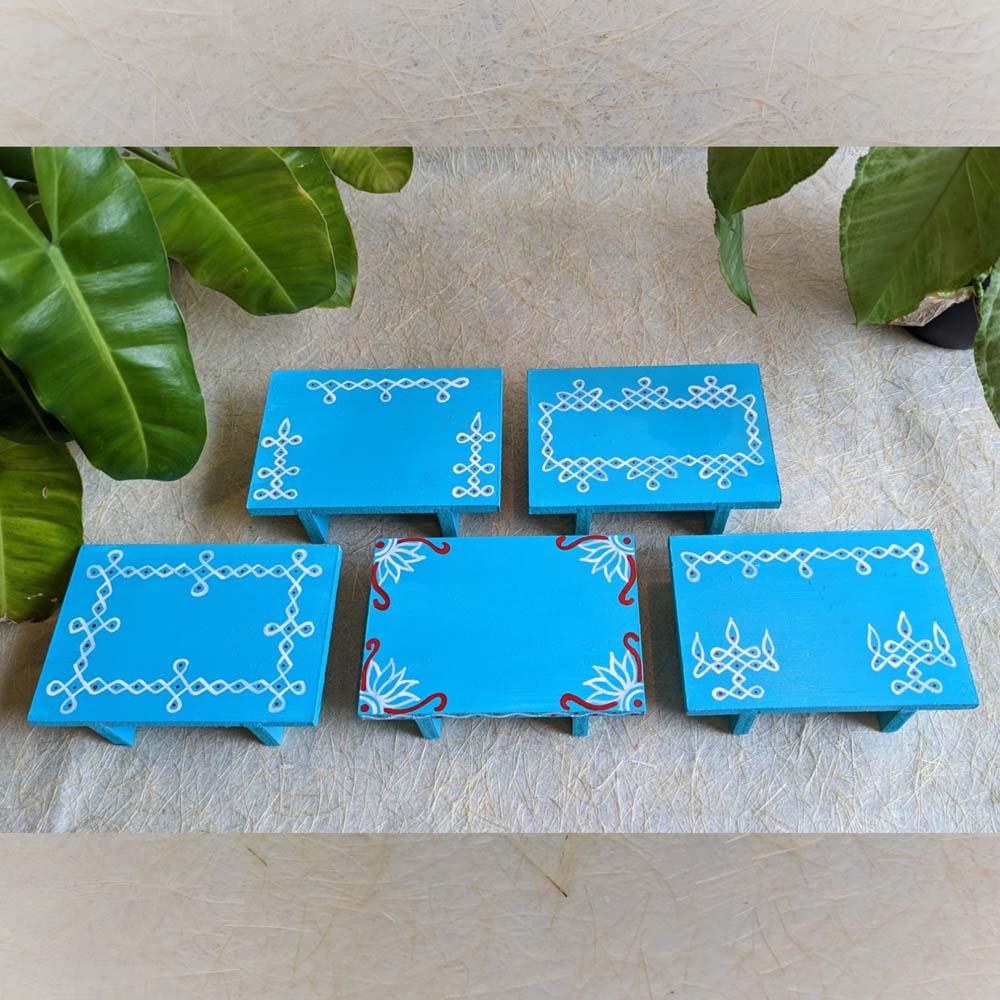 Sky Blue wooden pooja platform with intricate white Kolam patterns, perfect for rituals and decor.