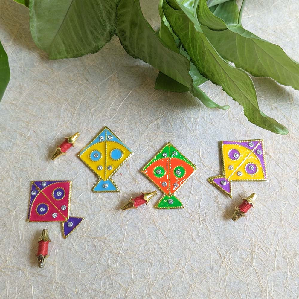 A colorful set of decorative kites with sparkling embellishments and gold borders.