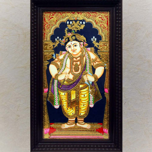 Tanjore painting of Vitoba Krishna with gold foil embellishments in a wooden frame.