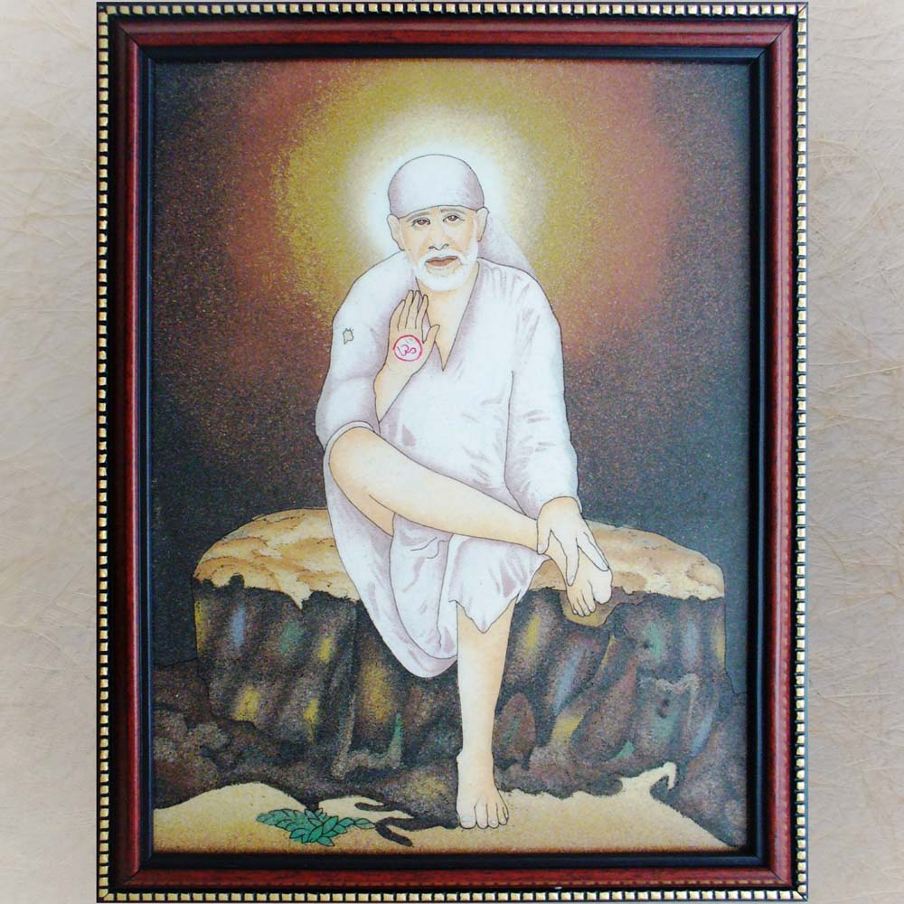 Framed painting of Shirdi Sai Baba seated on a stone bench, with a divine halo and raised hand in a blessing posture.