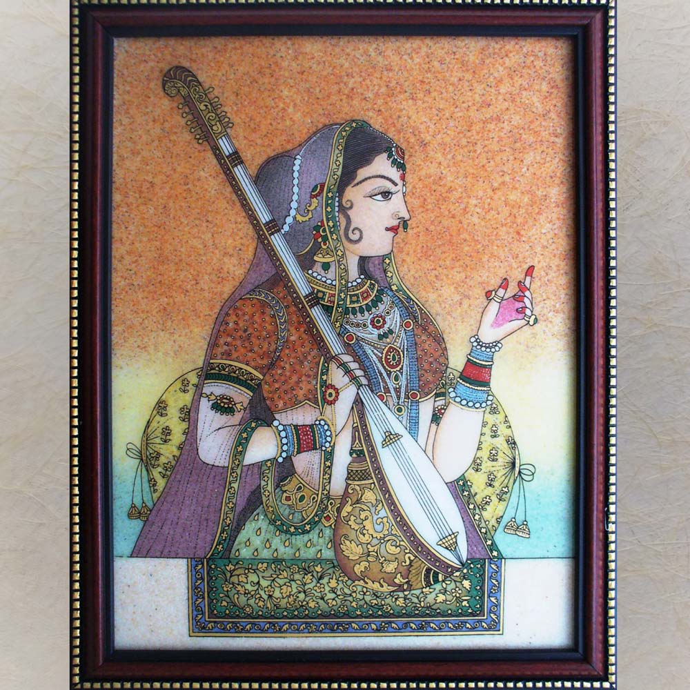 Framed painting of a lady holding a sitar, dressed in traditional attire with intricate jewelry, vibrant colors, and detailed patterns.