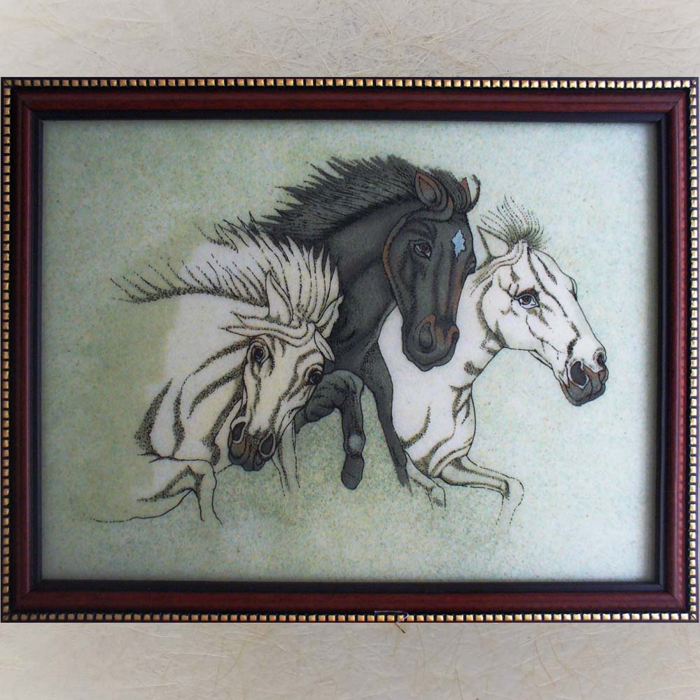 Framed painting of three galloping horses in black, white, and grey tones with intricate detailing and a soft background.