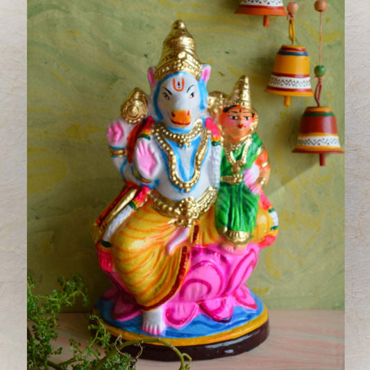 Handcrafted Navaratri Golu doll of Lord Hayagriva seated on a lotus with a devotee, painted in vibrant colors with intricate details.