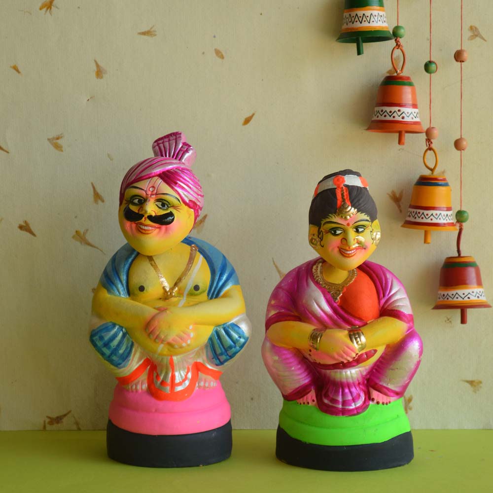 Navarathri Golu Dolls - Sitting Couple with Dancing Heads in vibrant traditional South Indian attire, hand-painted with detailed features.