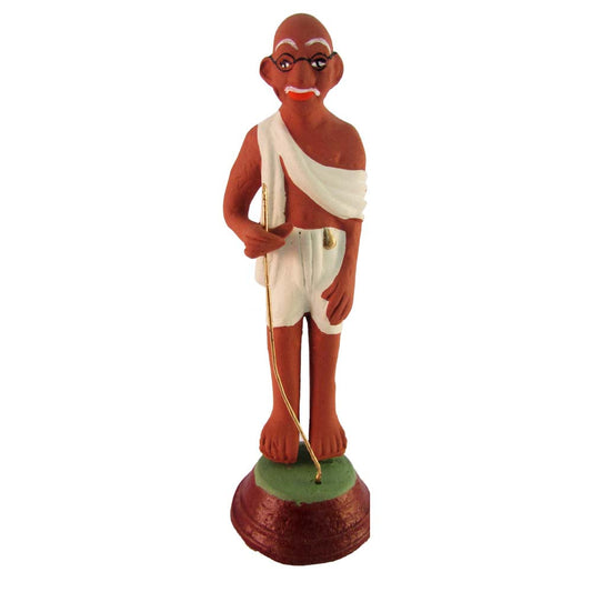 Handcrafted Mahatma Gandhi Golu doll dressed in white dhoti and shawl with a walking stick, representing simplicity and peace.