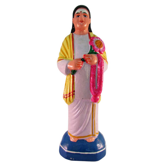 Handcrafted Devar Golu doll wearing traditional attire, holding a flower and garland, painted in bright colors.