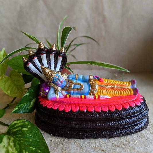 Handcrafted Ranganathar Golu Doll featuring Lord Vishnu reclining on Adishesha, intricately painted and ideal for Navaratri celebrations.